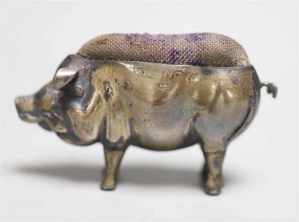 An early 20th century novelty silver pig pin cushion, Adie & Lovekin, circa 1905(marks very rubbed), length 54mm.